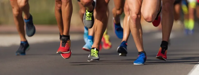 Marathon running race, people feet on city road